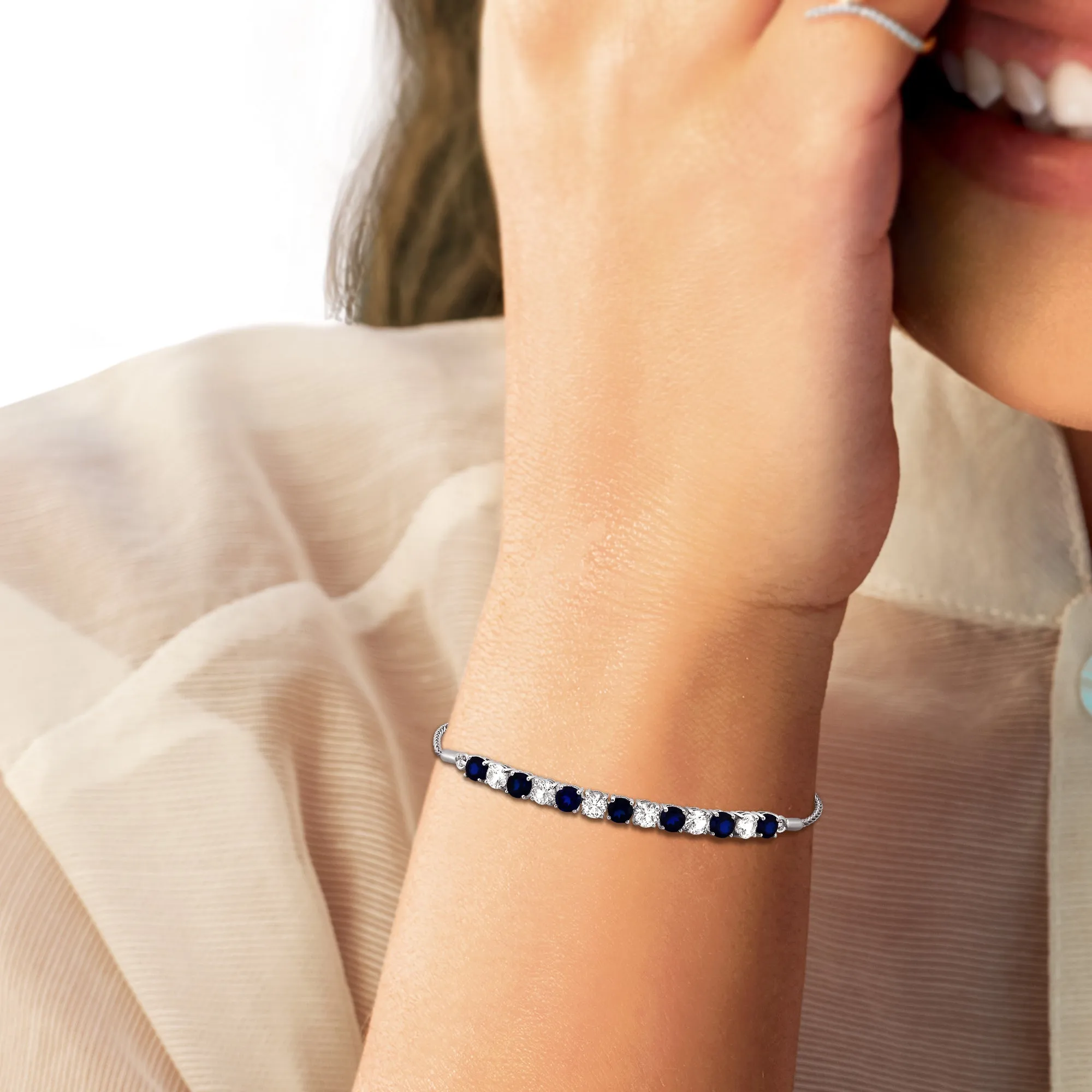 Jewelili Sterling Silver Round Created Blue Sapphire and Created White Sapphire Bolo Bracelet